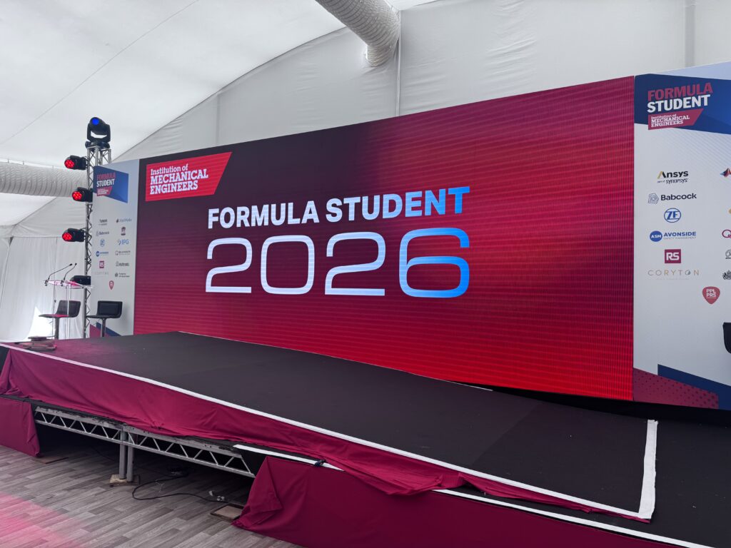 Formula Student 2026 stage and red event branding at Silverstone