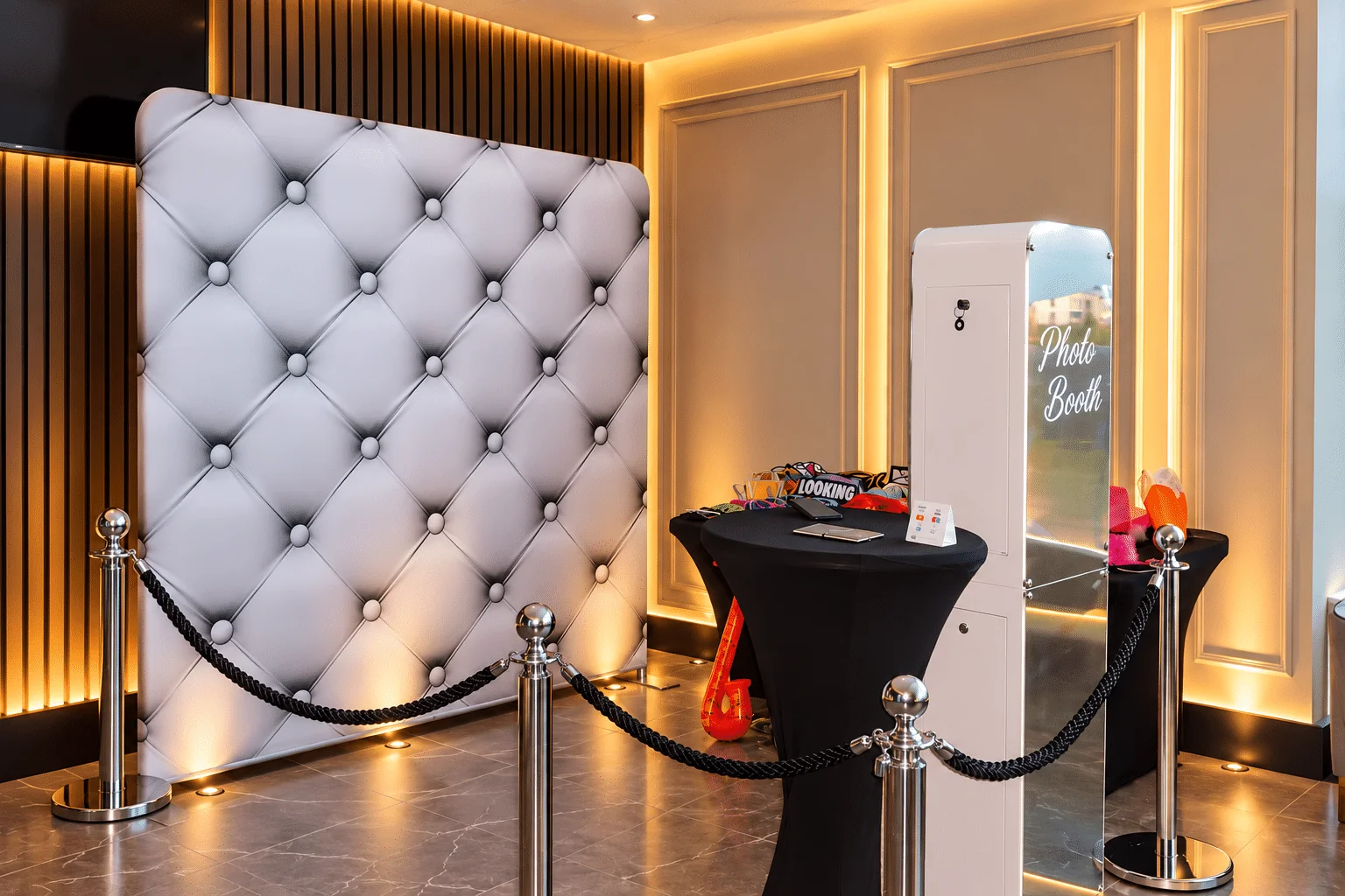 LA Events Premium Printed Photobooth with silver padded-effect backdrop, props and rope barriers