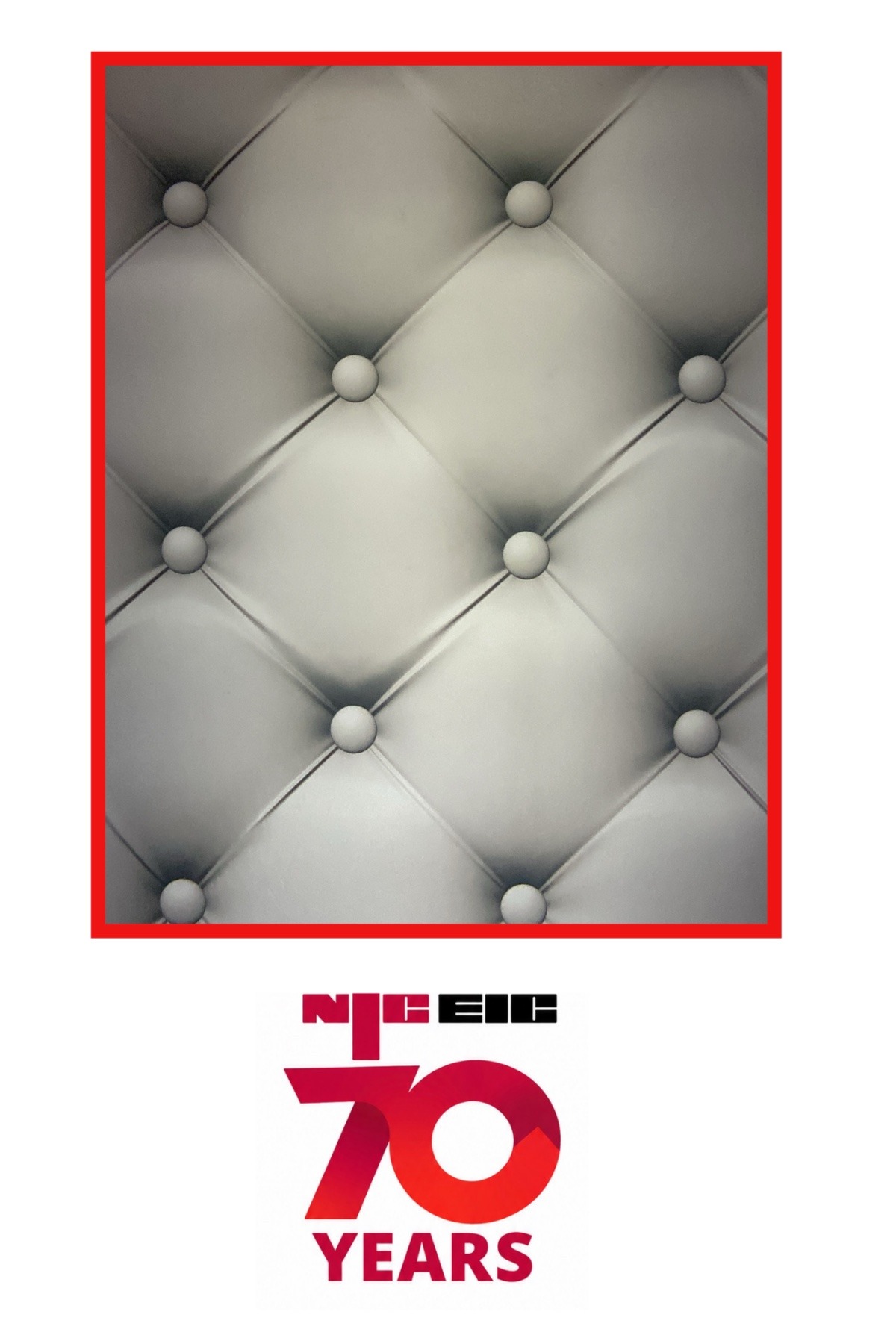 Empty grey padded photobooth backdrop inside a red frame with NICEIC 70 Years branding.